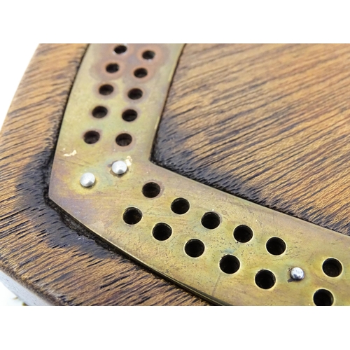 848 - Toy: A Victorian oak and brass cribbage board of heart form. Approx. 7