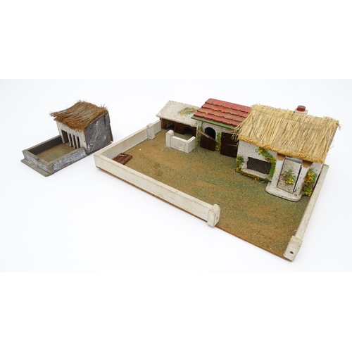 853 - Toys: A 20thC Hugar Models for Britains Ltd. farmyard with three farm outbuildings. Together with a ... 