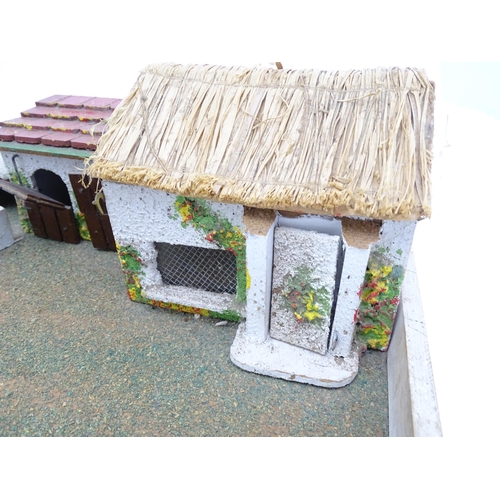 853 - Toys: A 20thC Hugar Models for Britains Ltd. farmyard with three farm outbuildings. Together with a ... 