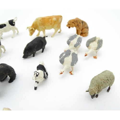 853 - Toys: A 20thC Hugar Models for Britains Ltd. farmyard with three farm outbuildings. Together with a ... 