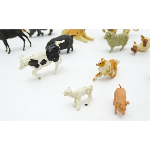 853 - Toys: A 20thC Hugar Models for Britains Ltd. farmyard with three farm outbuildings. Together with a ... 