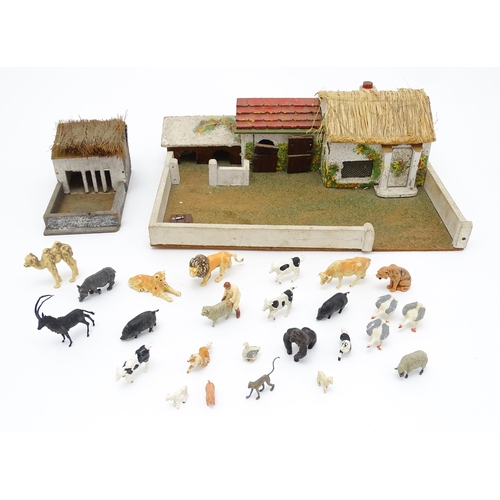 853 - Toys: A 20thC Hugar Models for Britains Ltd. farmyard with three farm outbuildings. Together with a ... 