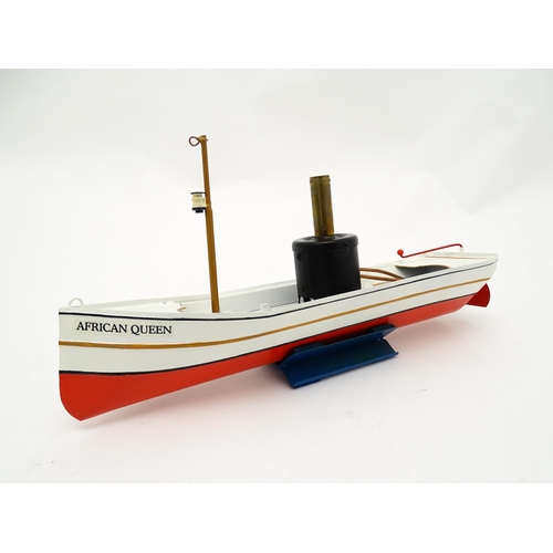 860 - Toy: A German Tucher & Walther live steam powered African Queen tin plate 'pop-pop' boat, with seate... 