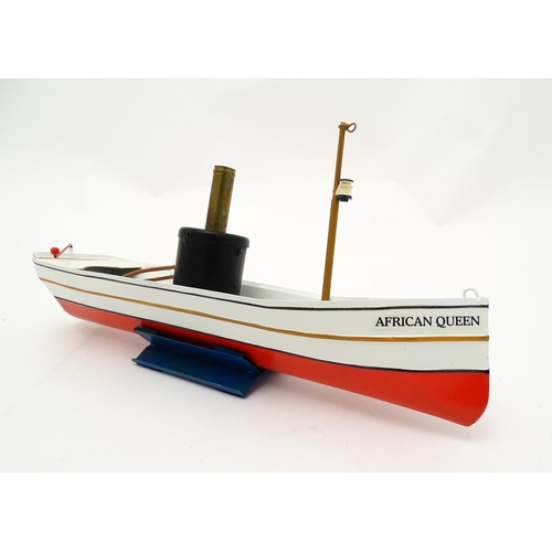 860 - Toy: A German Tucher & Walther live steam powered African Queen tin plate 'pop-pop' boat, with seate... 