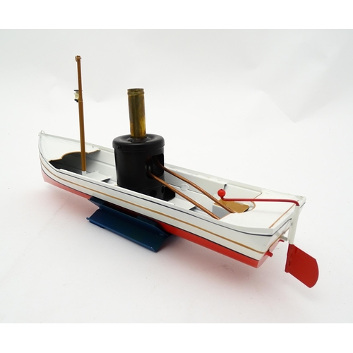 860 - Toy: A German Tucher & Walther live steam powered African Queen tin plate 'pop-pop' boat, with seate... 