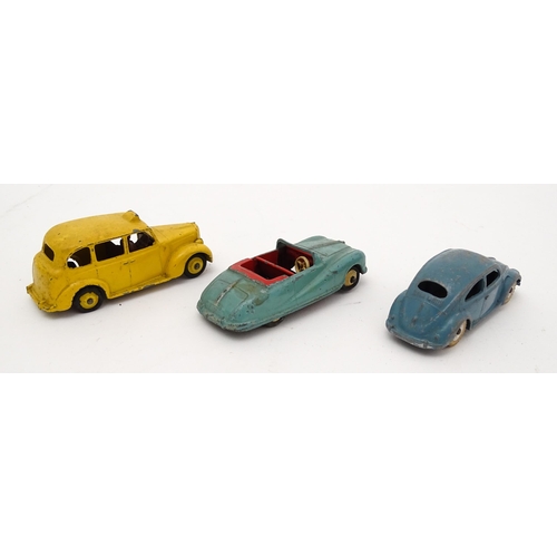 864 - Toys: A quantity of die cast scale model Dinky Toys to include Volkswagen, Austin Taxi, Austin Atlan... 