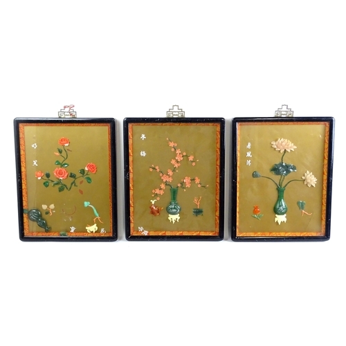 1055 - Three Chinese panels with carved hardstone decoration depicting flowers / blossom in vases. With Cha... 