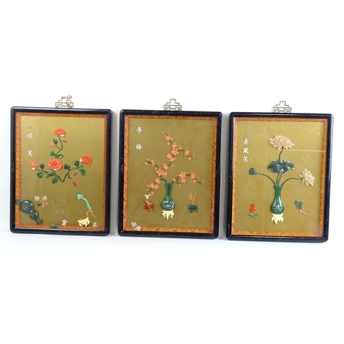 1055 - Three Chinese panels with carved hardstone decoration depicting flowers / blossom in vases. With Cha... 