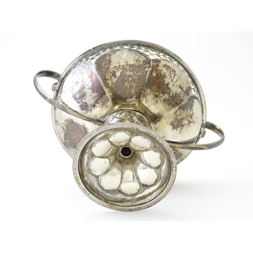 319 - A silver pedestal bon bon dish with twin handles.  Hallmarked Birmingham 1920, maker Mappin & Webb L... 