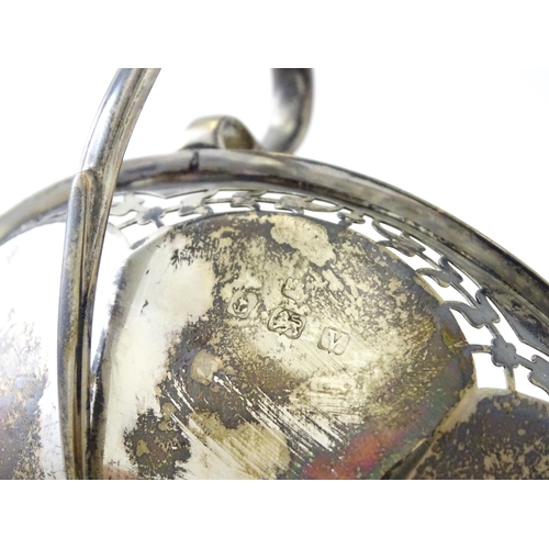 319 - A silver pedestal bon bon dish with twin handles.  Hallmarked Birmingham 1920, maker Mappin & Webb L... 