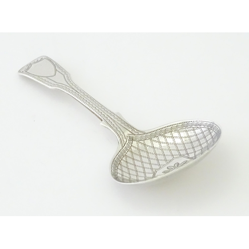 328 - A Geo IV silver caddy spoon with bright cut decoration hallmarked London 1820, maker George Wintle. ... 