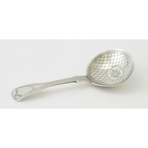 328 - A Geo IV silver caddy spoon with bright cut decoration hallmarked London 1820, maker George Wintle. ... 