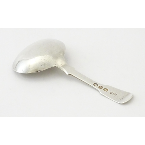 328 - A Geo IV silver caddy spoon with bright cut decoration hallmarked London 1820, maker George Wintle. ... 