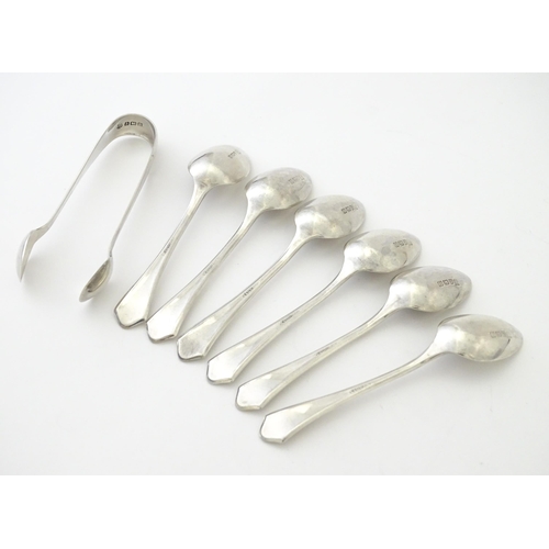 564 - A cased set of six silver teaspoons with sugar tongs en suite, hallmarked Birmingham 1929, maker Bar... 