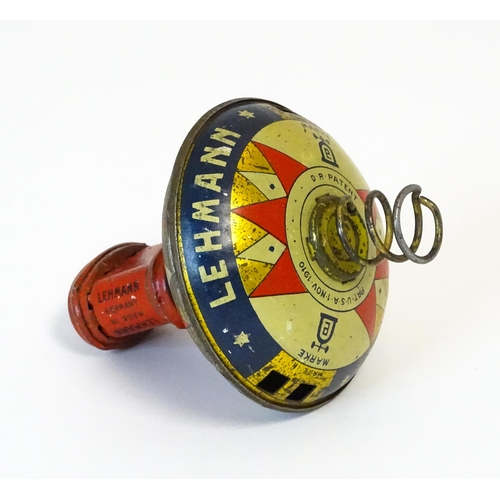 851 - Toys: A Lehmann tinplate Hop-Hop spinning top. Approx. 4