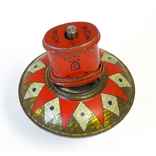 851 - Toys: A Lehmann tinplate Hop-Hop spinning top. Approx. 4