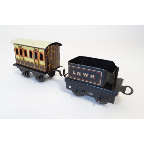 855 - Toys - Railway / Train Interest : A Bing tinplate clockwork train set comprising a locomotive, two t... 