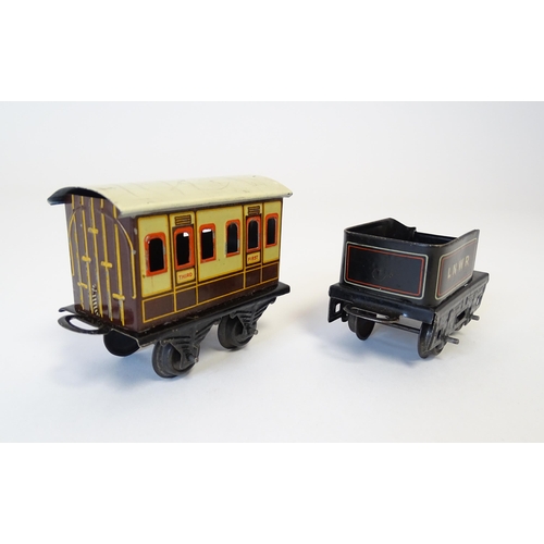 855 - Toys - Railway / Train Interest : A Bing tinplate clockwork train set comprising a locomotive, two t... 