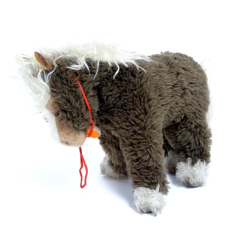 856 - Toy: A 20thC Steiff Cosy Pony, plush horse toy. Approx. 8