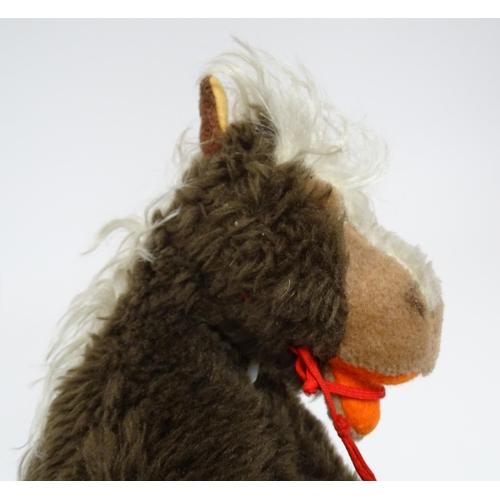 856 - Toy: A 20thC Steiff Cosy Pony, plush horse toy. Approx. 8