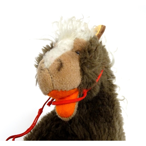 856 - Toy: A 20thC Steiff Cosy Pony, plush horse toy. Approx. 8