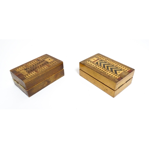 865 - Toys: Two early 20thC travelling / folding cribbage boards with inlaid detail. Together with a pack ... 