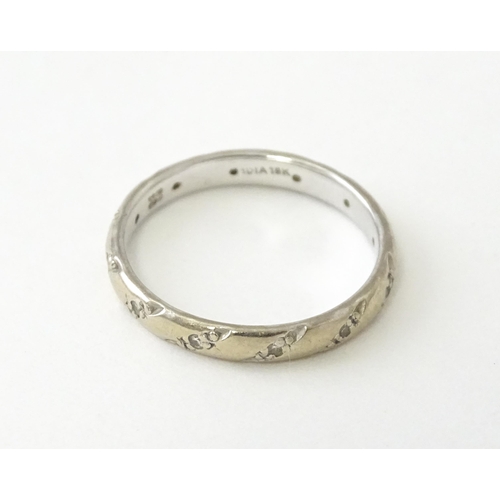 630 - An 18ct white gold ring set with diamonds. Ring size approx. N