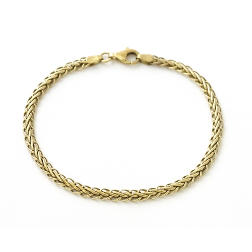 674 - A 9ct gold bracelet. Approx.7 1/2