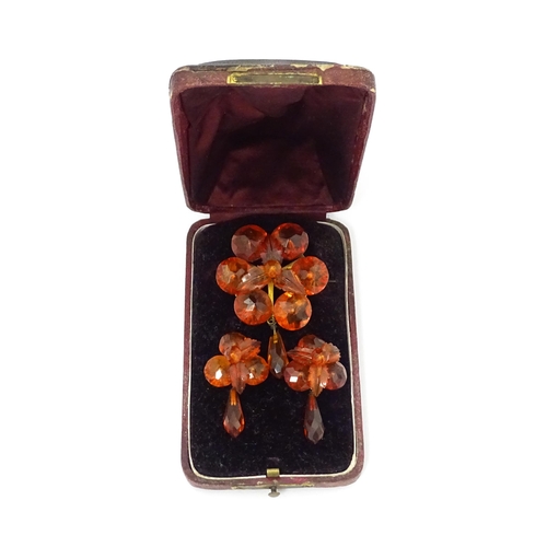 678 - A pair of vintage gilt metal drop earrings set with amber coloured facet detail, together with a mat... 