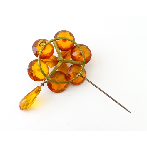 678 - A pair of vintage gilt metal drop earrings set with amber coloured facet detail, together with a mat... 