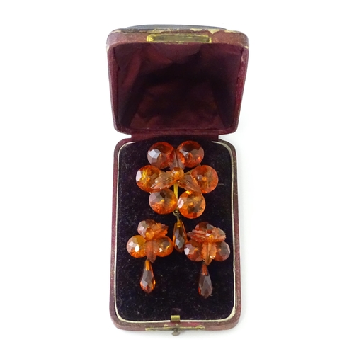 678 - A pair of vintage gilt metal drop earrings set with amber coloured facet detail, together with a mat... 