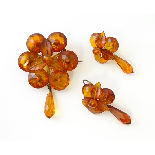 678 - A pair of vintage gilt metal drop earrings set with amber coloured facet detail, together with a mat... 