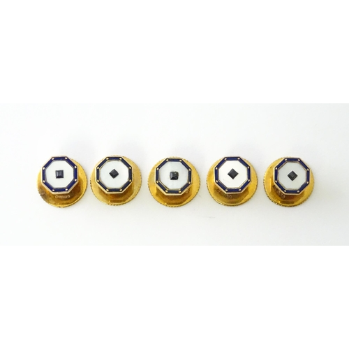 679 - A set of five 9ct gold studs set with mother of pearl blue enamel detail and blue stones