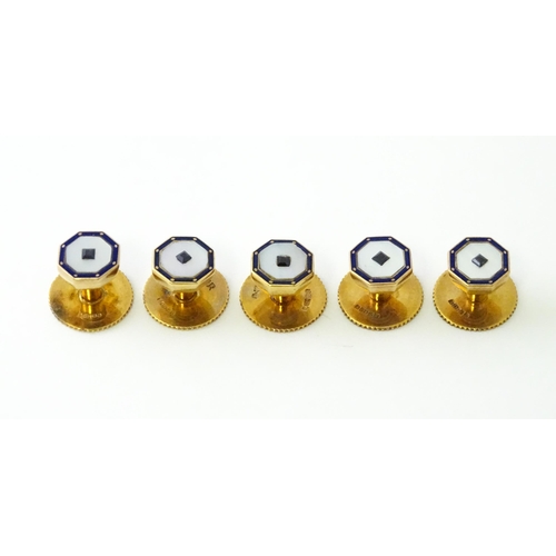 679 - A set of five 9ct gold studs set with mother of pearl blue enamel detail and blue stones