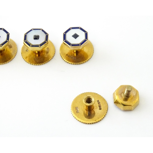 679 - A set of five 9ct gold studs set with mother of pearl blue enamel detail and blue stones