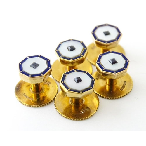 679 - A set of five 9ct gold studs set with mother of pearl blue enamel detail and blue stones