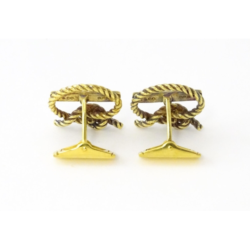 681 - A pair of silver gilt Cunard cufflinks with rope twist detail and set with a diamond. Approx. 5/8