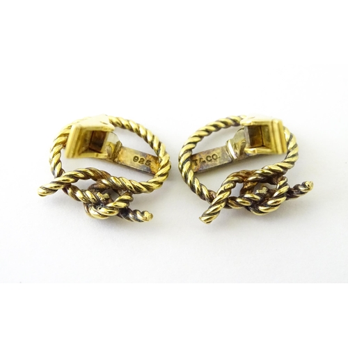 681 - A pair of silver gilt Cunard cufflinks with rope twist detail and set with a diamond. Approx. 5/8