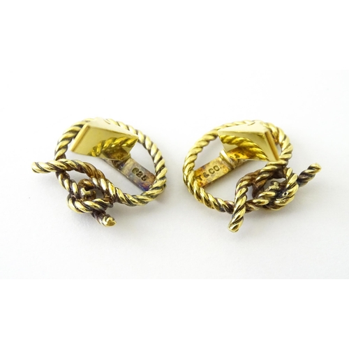 681 - A pair of silver gilt Cunard cufflinks with rope twist detail and set with a diamond. Approx. 5/8