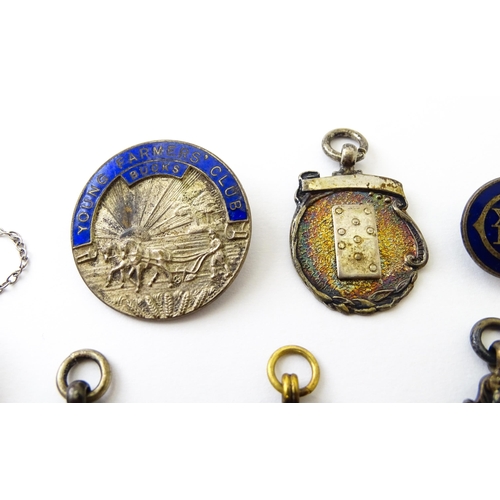 726 - Assorted fobs, badges etc to include: Three hallmarked silver fobs relating to the game of dominoes ... 