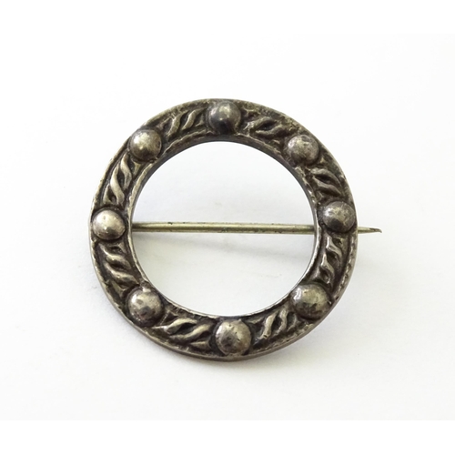 732 - A Scottish silver brooch with Celtic decoration hallmarked Glasgow 1956, maker Robert Allison & Son.... 