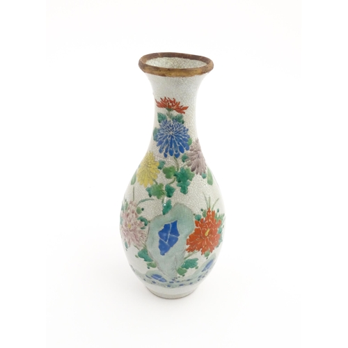 11 - An Oriental vase with crackle glaze decorated with flowers, foliage and a female figure. Approx. 12