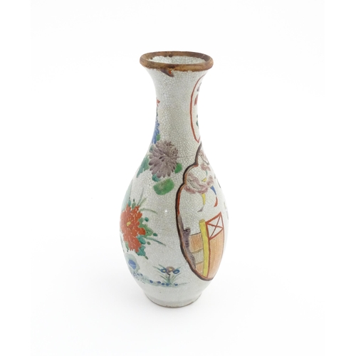 11 - An Oriental vase with crackle glaze decorated with flowers, foliage and a female figure. Approx. 12