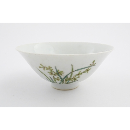 10 - A Chinese bowl of flared form decorated with floral and foliate detail. Character marks under. Appro... 