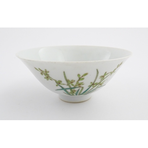 10 - A Chinese bowl of flared form decorated with floral and foliate detail. Character marks under. Appro... 