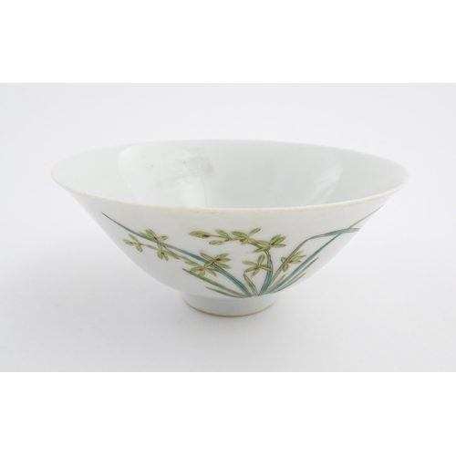 10 - A Chinese bowl of flared form decorated with floral and foliate detail. Character marks under. Appro... 