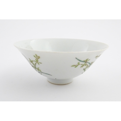 10 - A Chinese bowl of flared form decorated with floral and foliate detail. Character marks under. Appro... 