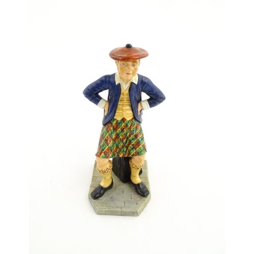 108 - A Royal Worcester figure Sandy / The Scotsman no. 913, modelled by James Hadley 1881. Marked under. ... 