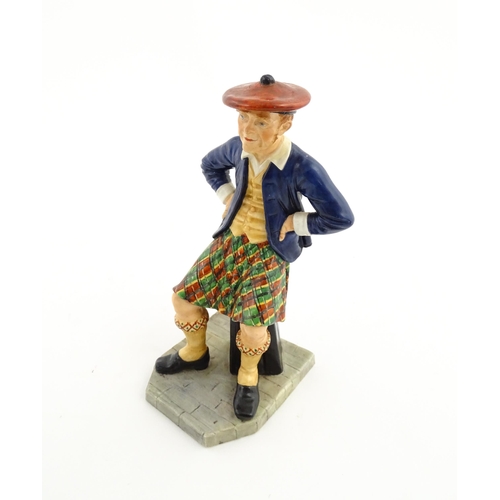 108 - A Royal Worcester figure Sandy / The Scotsman no. 913, modelled by James Hadley 1881. Marked under. ... 