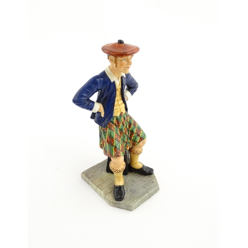 108 - A Royal Worcester figure Sandy / The Scotsman no. 913, modelled by James Hadley 1881. Marked under. ... 